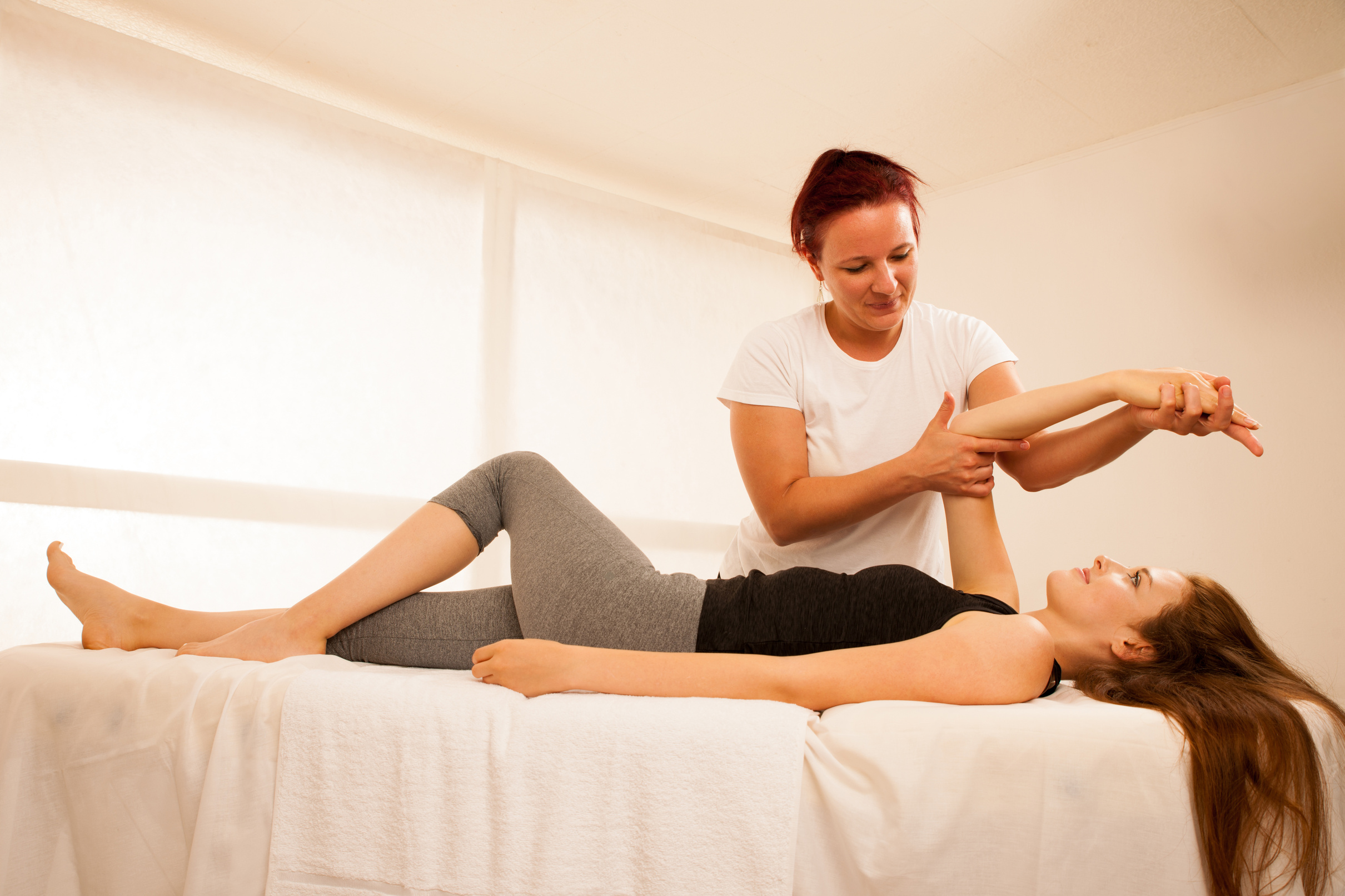 Physiotherapy Therapist Exercising with Patient